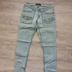 Low rise jeans in a washed green color